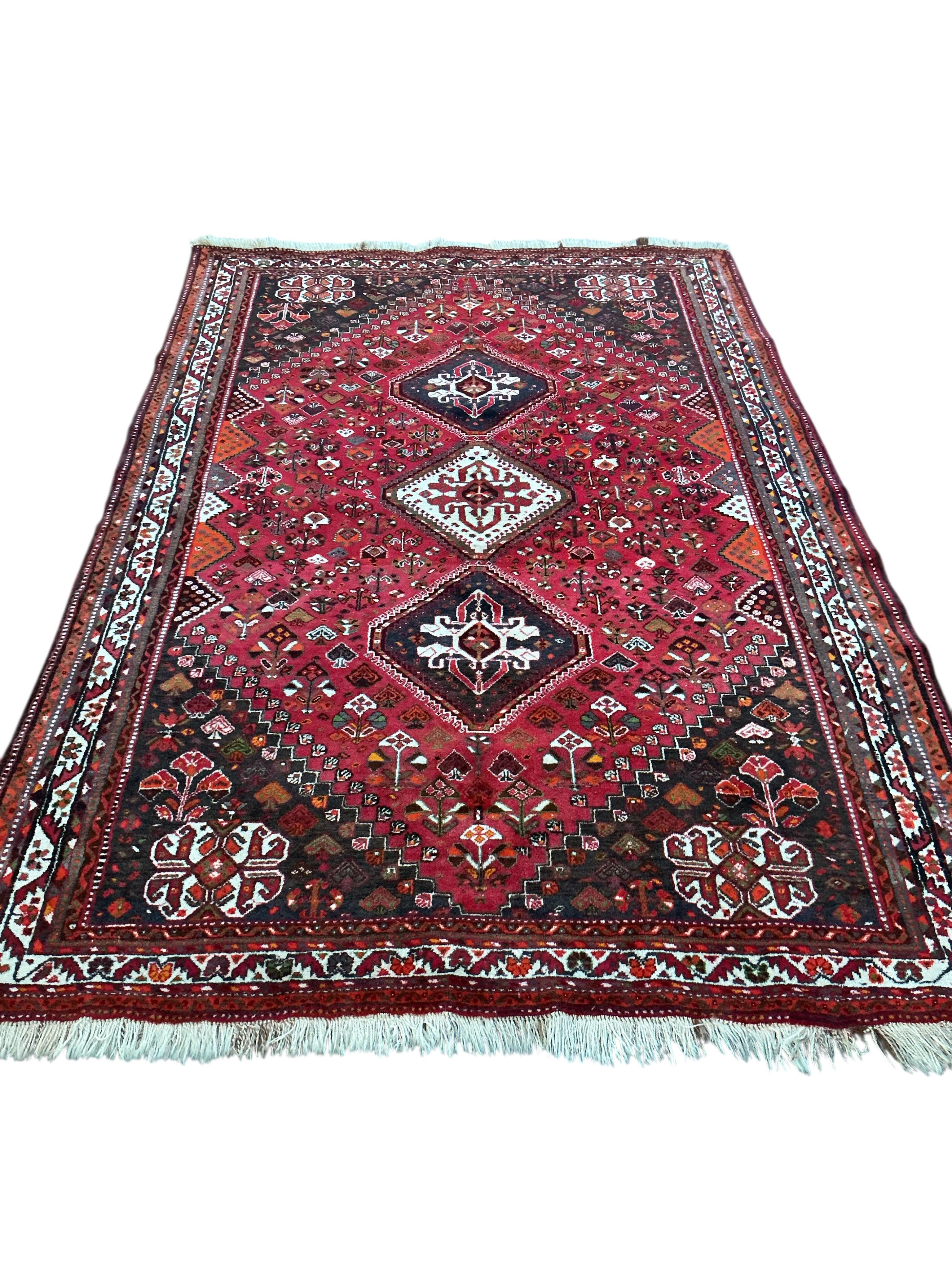 A Hamadan red ground carpet, 256 x 170cm